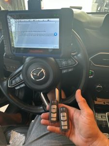 Automotive locksmith coding a Mazda CX-5 key fob