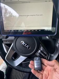 Automotive locksmith coding a Kia Optima key fob
