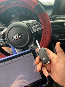 Automotive locksmith coding a Kia Sorento key fob