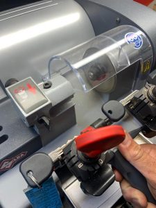 Automotive locksmith copying Pontiac transponder key that needs to be coded