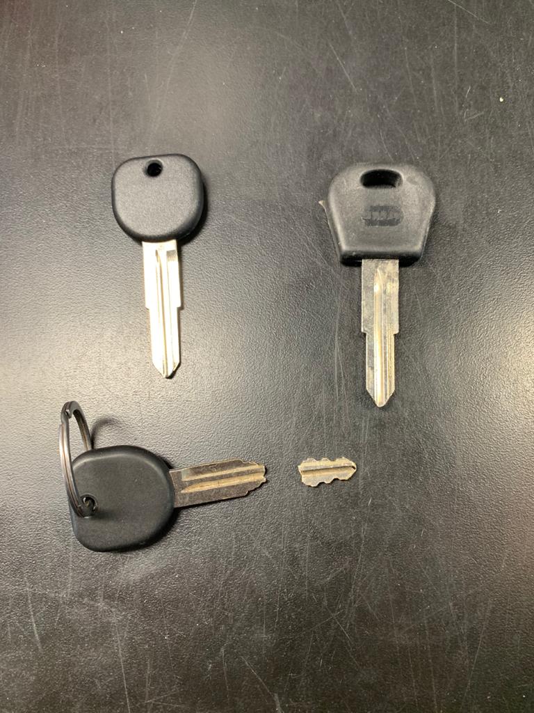 Broken car key and replacement keys