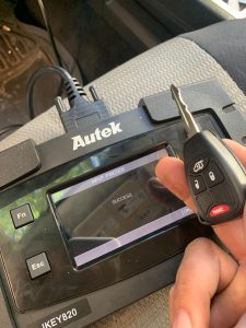 Automotive locksmith coding a Dodge Pickup Truck transponder key