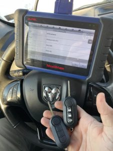 Automotive locksmith is coding a new Dodge Promaster key