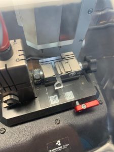 Uncut emergency key on cutting machine - Automotive locksmith