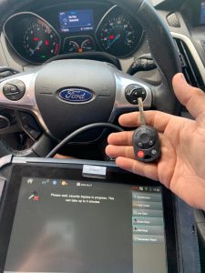 Automotive locksmith coding a Ford Mustang key