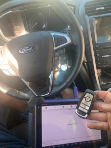 Automotive locksmith coding a Ford Mustang key fob