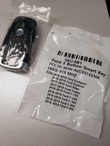 Aftermarket Ford key fob replacement M3N-A2C93142300 and emergency key