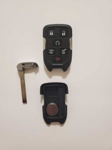 An inside look of GMC key fob and battery