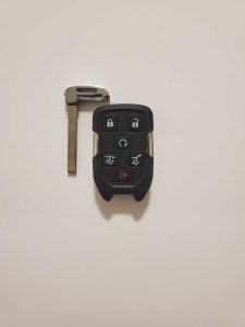 An emergency key and key fob GMC- Uncut