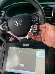 Automotive locksmith coding a Honda Odyssey key fob