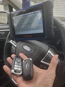 An automotive locksmith coding a new Ford Expedition key