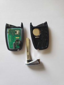 The key fob on the inside - battery, chip and emergency key