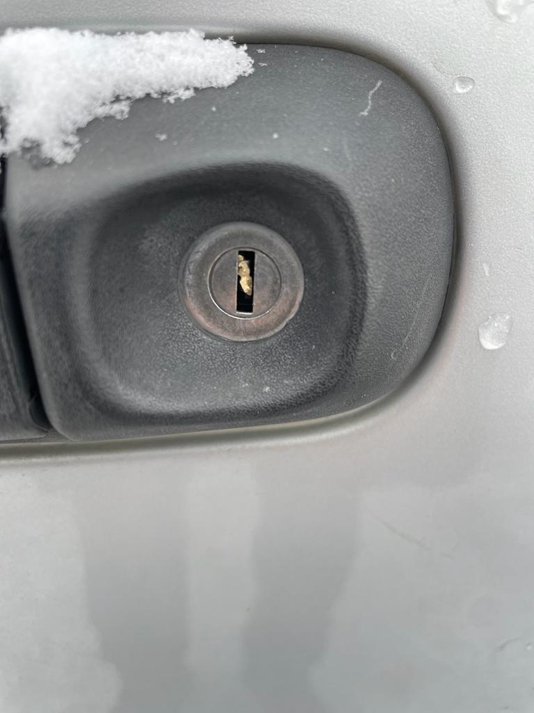 Broken car key inside door cylinder