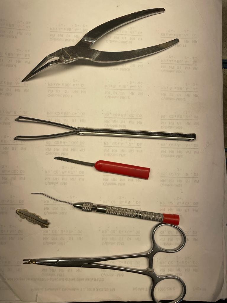 Broken key removal and extraction tools used by a locksmith