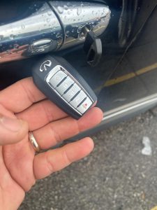 Unlock your car door with the emergency key provided with the key fob