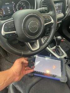 Automotive locksmith coding a Jeep Cherokee key fob