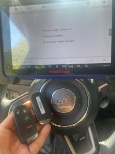 Automotive locksmith coding a Jeep Renegade key fobs