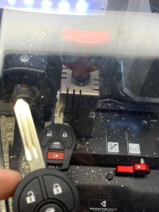 Automotive locksmith makes a new key from the broken pieces