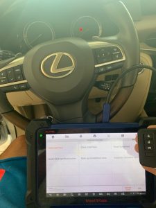 Automotive locksmith coding a new Lexus key on-site