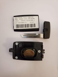 The inside look of a key fob - Battery, chip and emergency key