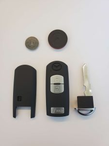 Key fob parts, emergency key and battery - Mazda