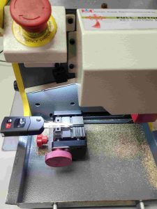 Cutting machine used by an automotive locksmith for Mazda keys