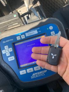 Automotive locksmith coding a Mitsubishi transponder key