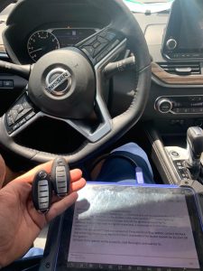 Automotive locksmith coding a Nissan Sentra key fobs