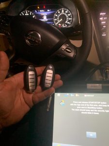Automotive locksmith coding a Nissan GT-R key fobs