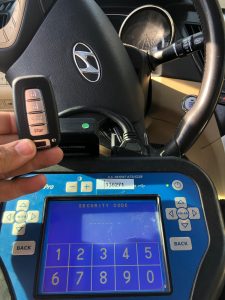 An automotive locksmith coding a new Hyundai Tiburon key