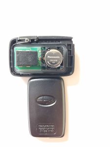An inside look of Subaru key fob and battery