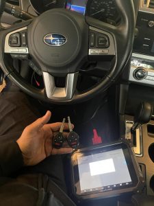 Automotive locksmith coding a Subaru Tribeca key 