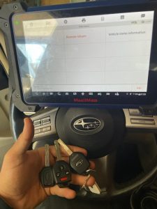 An automotive locksmith coding a new Subaru Ascent key