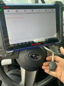 Automotive locksmith coding a new Subaru transponder key on-site