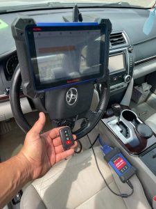 Automotive locksmith coding a Toyota Camry key fob