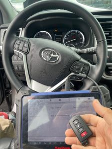 Automotive locksmith coding a Toyota Prius key fob