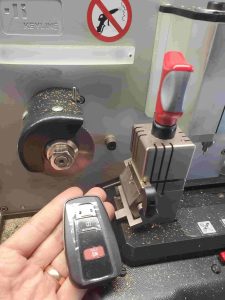 Cutting machine used by an automotive locksmith for Toyota keys