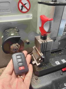 New Toyota key fob on a computer operated cutting machine