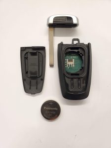 The inside look of a key fob - Battery, chip and emergency key
