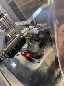 Automotive locksmith cutting a new VW key